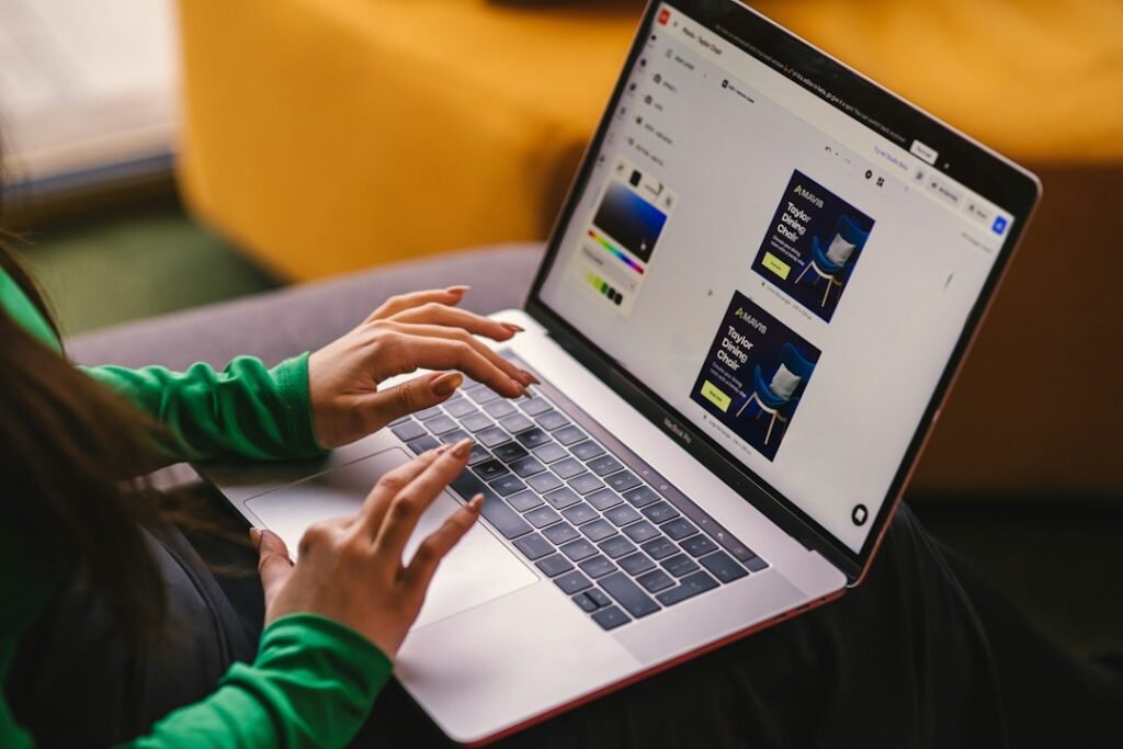 Digital marketer designing visual advertising content on a computer