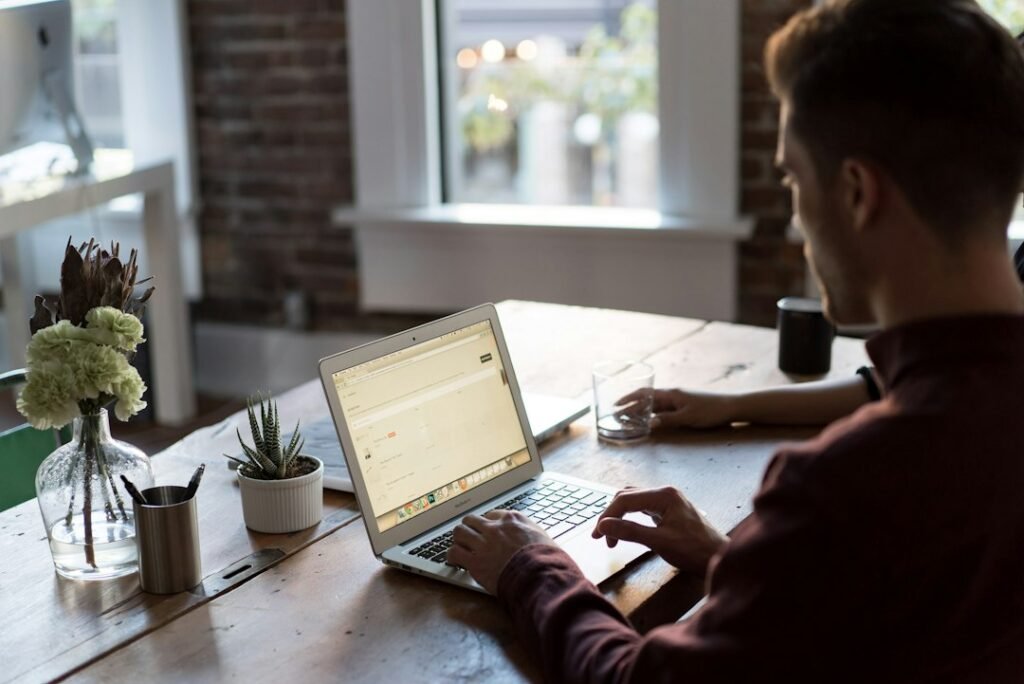 Laptop and business planning materials illustrating manageable website development payments